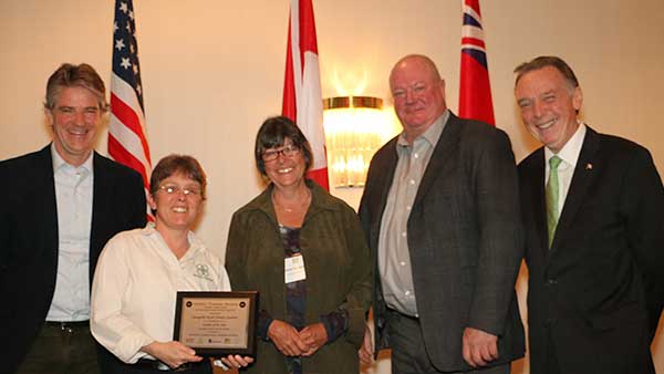 Trish Fry, manager, and Karen Achenbach, horticultural manager, receive award for Annapolis Royal Historic Gardens from Alexander Reford, Chair, Canadian Garden Council, Bill Hardy, President, Canadian Nursery Landscape Association and Peter Kent, Member of Parliament.